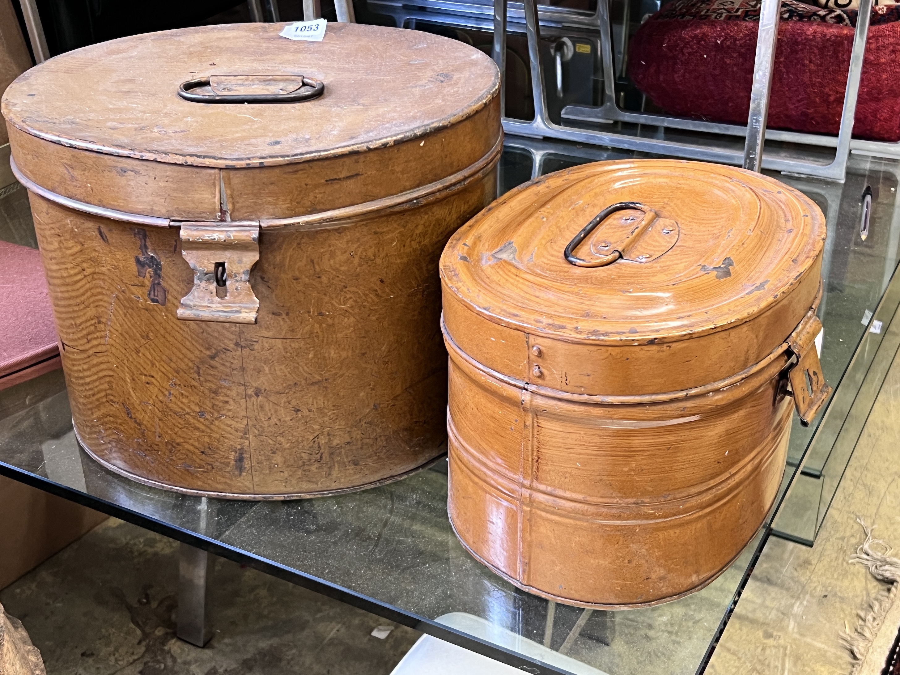 Two Victorian tin hat boxes with painted simulated grain, largest 40cm